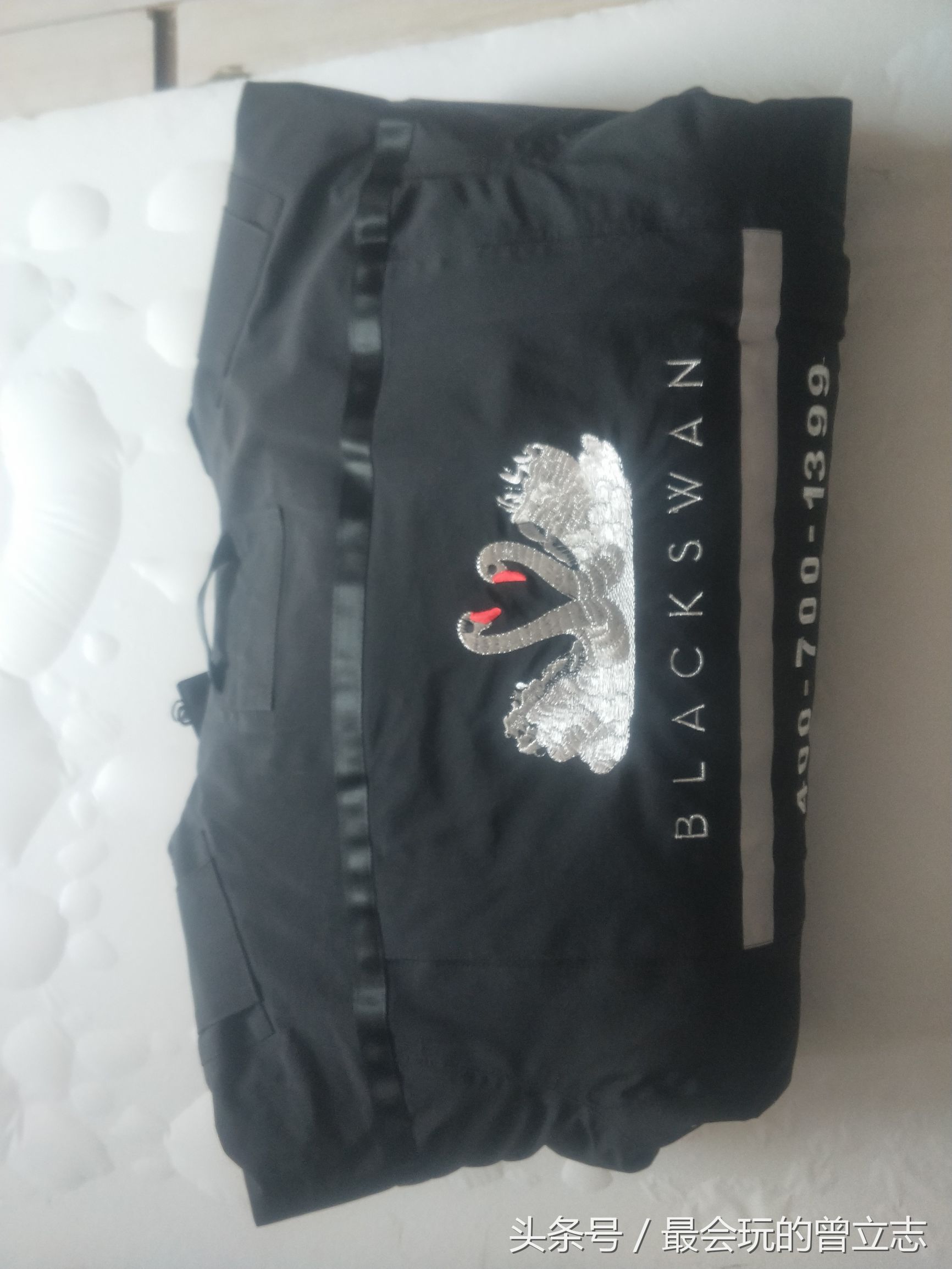 北京庆洋制衣与蛋糕企业黑天鹅制作冲锋衣